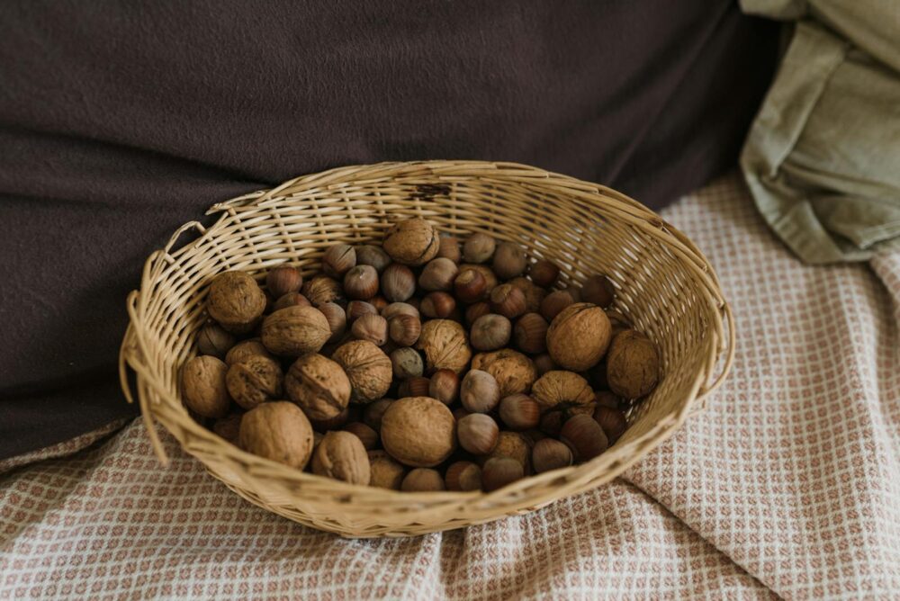 Assorted Nuts with Shells in a Wicker Basket